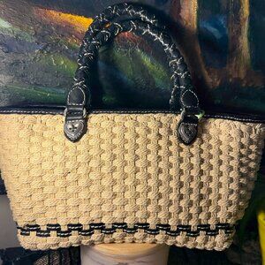 Brighton natural woven bag with black leather twisted handles.